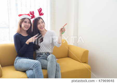 Happy friends two young asian woman smiling  47969648