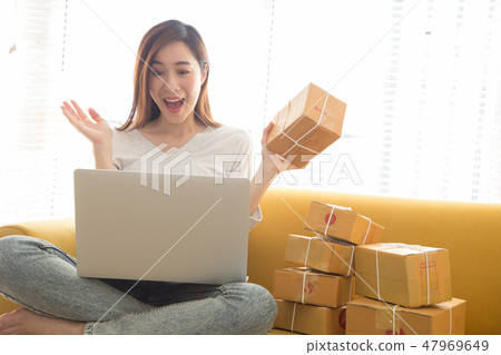 Surprised happy and joyful attractive entrepreneur 47969649