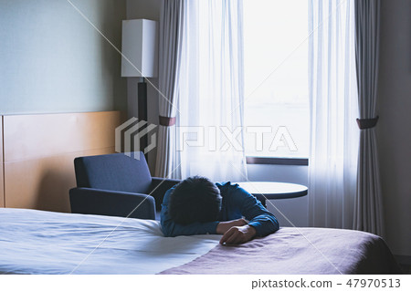 A man falling in bed A man falling in bed 47970513