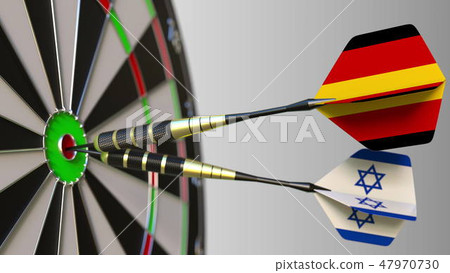 Flags of Germany and Israel on darts hitting bullseye of the target. International cooperation or Flags of Germany and Israel on darts hitting bullseye of the target. International cooperation or 47970730