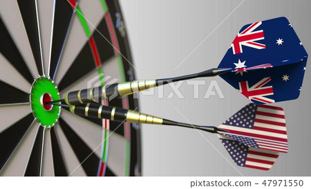 Flags of Australia and the USA on darts hitting bullseye of the target. International cooperation or Flags of Australia and the USA on darts hitting bullseye of the target. International cooperation or 47971550