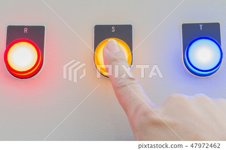 Forefinger touch on yellow stop button. 47972462