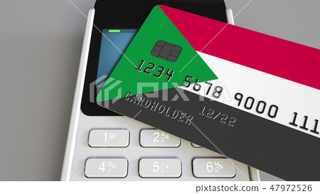 Payment terminal with credit card featuring flag of Sudan. Sudanese national banking system Payment terminal with credit card featuring flag of Sudan. Sudanese national banking system 47972526