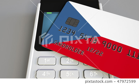 Payment terminal with credit card featuring flag of the Czech Republic. National banking system 47972599