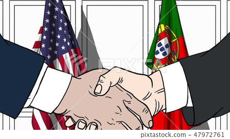 Businessmen or politicians shake hands against flags of USA and Portugal. Official meeting or Businessmen or politicians shake hands against flags of USA and Portugal. Official meeting or 47972761