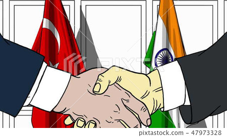 Businessmen or politicians shaking hands against flags of Turkey and India. Meeting or cooperation Businessmen or politicians shaking hands against flags of Turkey and India. Meeting or cooperation 47973328