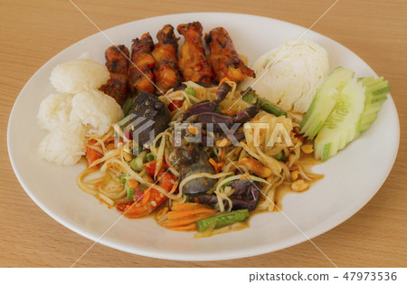 Som tum Thai papaya salad with sticky rice. Som tum Thai papaya salad with sticky rice. 47973536