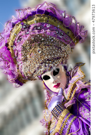 Woman in violet mask at The Carnival of Venice 47973613