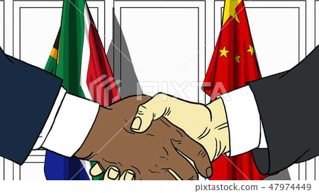 Businessmen or politicians shake hands against flags of South Africa and China. Official meeting or 47974449