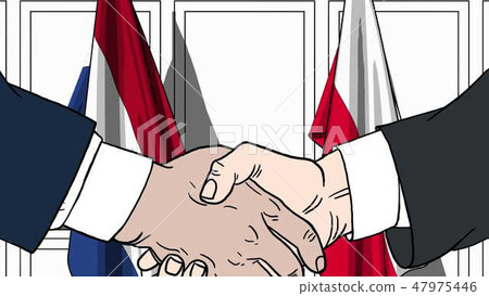Businessmen or politicians shake hands against flags of Netherlands and Poland. Official meeting or 47975446