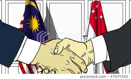 Businessmen or politicians shake hands against flags of Malaysia and Singapore. Official meeting or 47975500