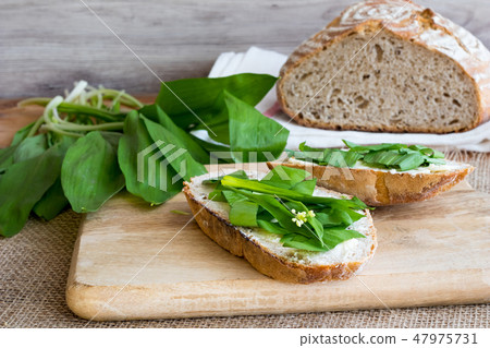 Sourdough bread with butter and wild garlic Sourdough bread with butter and wild garlic 47975731