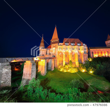 Beautiful night panorama of the Hunyad Castle Beautiful night panorama of the Hunyad Castle 47976086