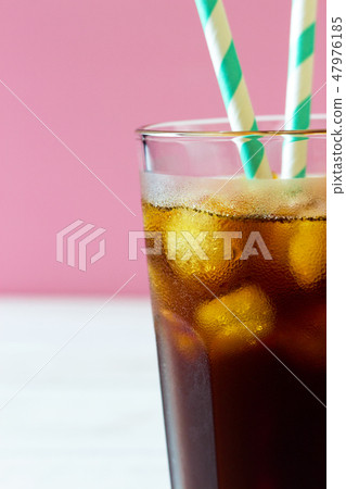 Close up coffee with ice and striped straws Close up coffee with ice and striped straws 47976185