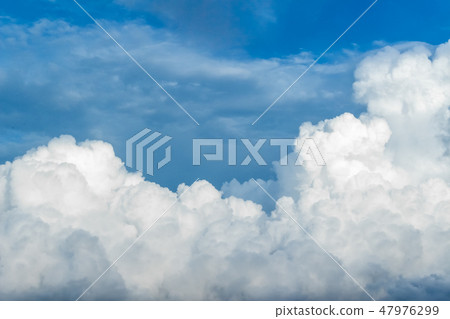 Curvy clouds against the blue sky 47976299