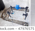 Water pipe and meter with waterspout on the floor. 47976575