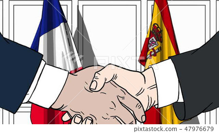Businessmen or politicians shaking hands against flags of France and Spain. Meeting or cooperation Businessmen or politicians shaking hands against flags of France and Spain. Meeting or cooperation 47976679
