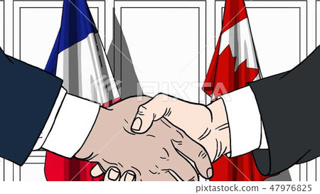 Businessmen or politicians shaking hands against flags of France and Canada. Meeting or cooperation 47976825