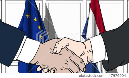 Businessmen or politicians shaking hands against flags of EU and Netherlands. Meeting or cooperation Businessmen or politicians shaking hands against flags of EU and Netherlands. Meeting or cooperation 47976904