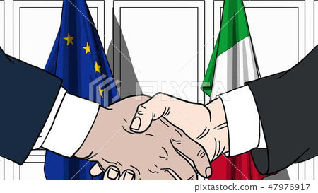Businessmen or politicians shaking hands against flags of EU and Italy. Meeting or cooperation 47976917