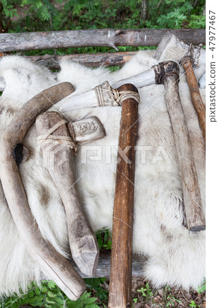 Different kind of stone age axes in a row 47977467