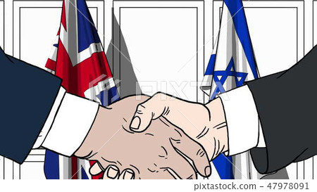 Businessmen or politicians shake hands against flags of Britain and Israel. Official meeting or Businessmen or politicians shake hands against flags of Britain and Israel. Official meeting or 47978091