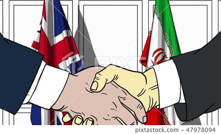 Businessmen or politicians shake hands against flags of Britain and Iran. Official meeting or Businessmen or politicians shake hands against flags of Britain and Iran. Official meeting or 47978094