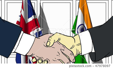 Businessmen or politicians shaking hands against flags of Great Britain and India. Meeting or Businessmen or politicians shaking hands against flags of Great Britain and India. Meeting or 47978097