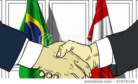 Businessmen or politicians shake hands against flags of Brazil and Peru. Official meeting or 47978136