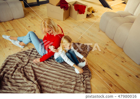 Upset blonde girl listening to her mommy Upset blonde girl listening to her mommy 47980016