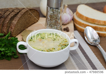 Mushroom soup with croutons in a white dish. Mushroom soup with croutons in a white dish. 47980596