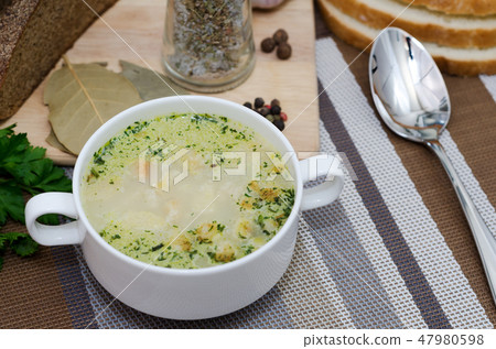 Mushroom soup with croutons in a white dish. Mushroom soup with croutons in a white dish. 47980598