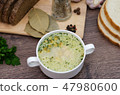 Mushroom soup with croutons in a white dish. 47980600