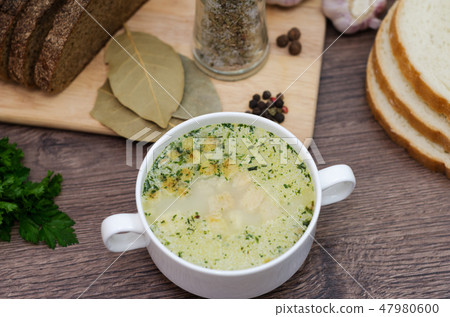 Mushroom soup with croutons in a white dish. Mushroom soup with croutons in a white dish. 47980600