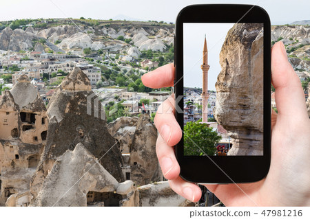 ancient rock-cut house and mosque in Goreme town ancient rock-cut house and mosque in Goreme town 47981216