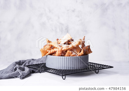 Brushwood - russian traditional cookies with powdered sugar. Food consept. Plate with hvorost on Brushwood - russian traditional cookies with powdered sugar. Food consept. Plate with hvorost on 47984156