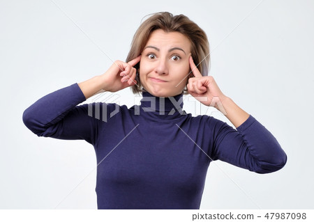 Woman generates new idea in mind, looks thoughtfully 47987098