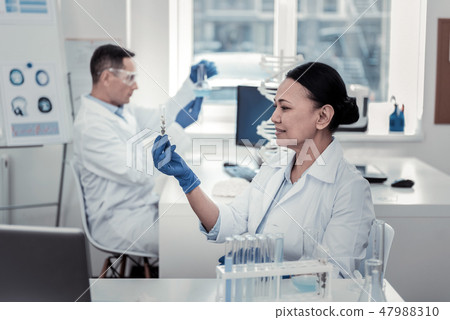 Scientists studying rare plants in the laboratory Scientists studying rare plants in the laboratory 47988310