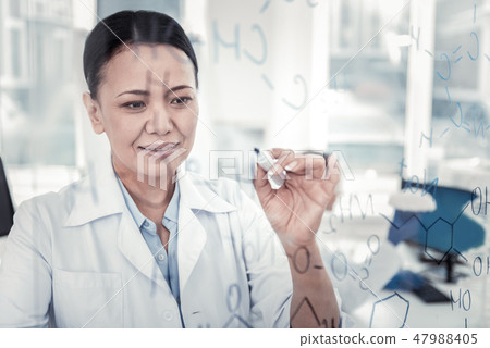 Concentrated scientist thinking on the new formula Concentrated scientist thinking on the new formula 47988405