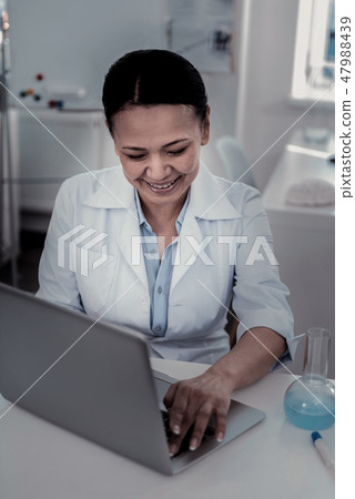 Young female scientist working with data on the computer 47988439