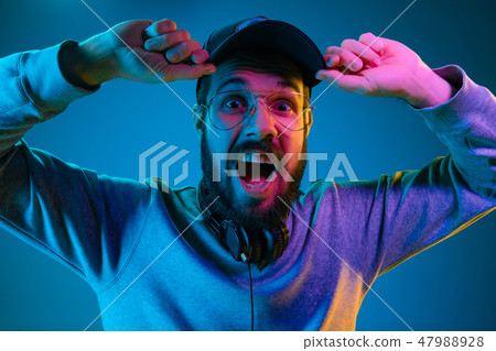 Enjoying his favorite music. Enjoying his favorite music. 47988928
