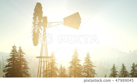 Typical Old Windmill turbine in forest at sunset Typical Old Windmill turbine in forest at sunset 47989045