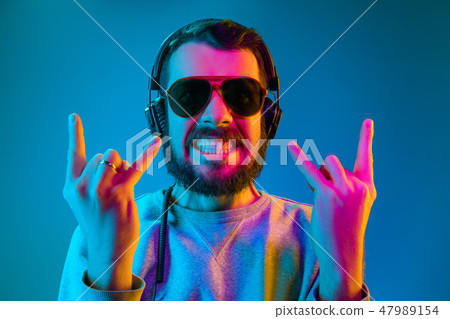 Enjoying his favorite music. Enjoying his favorite music. 47989154