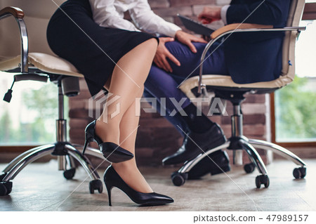 Business woman is flirting with a business man 47989157