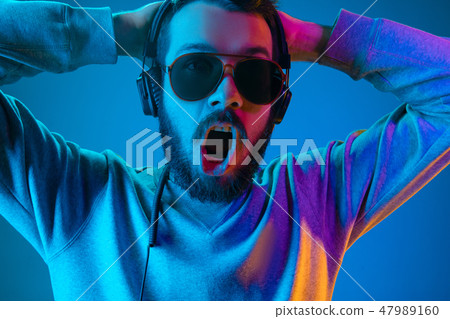 Enjoying his favorite music. Enjoying his favorite music. 47989160
