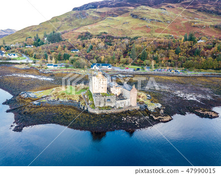 Aerial view of the historic Eilean Donan Castle by Dornie in autumn, Scotland Aerial view of the historic Eilean Donan Castle by Dornie in autumn, Scotland 47990015
