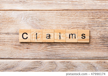 claims word written on wood block.  47990174