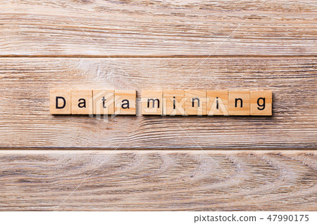 Data mining word written on wood block. Data mining word written on wood block. 47990175
