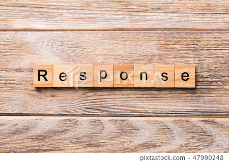 RESPONSE word written on wood block.  47990248