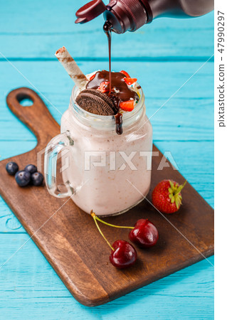 Fresh strawberry milkshake and berries sprinkles chocolate. 47990297
